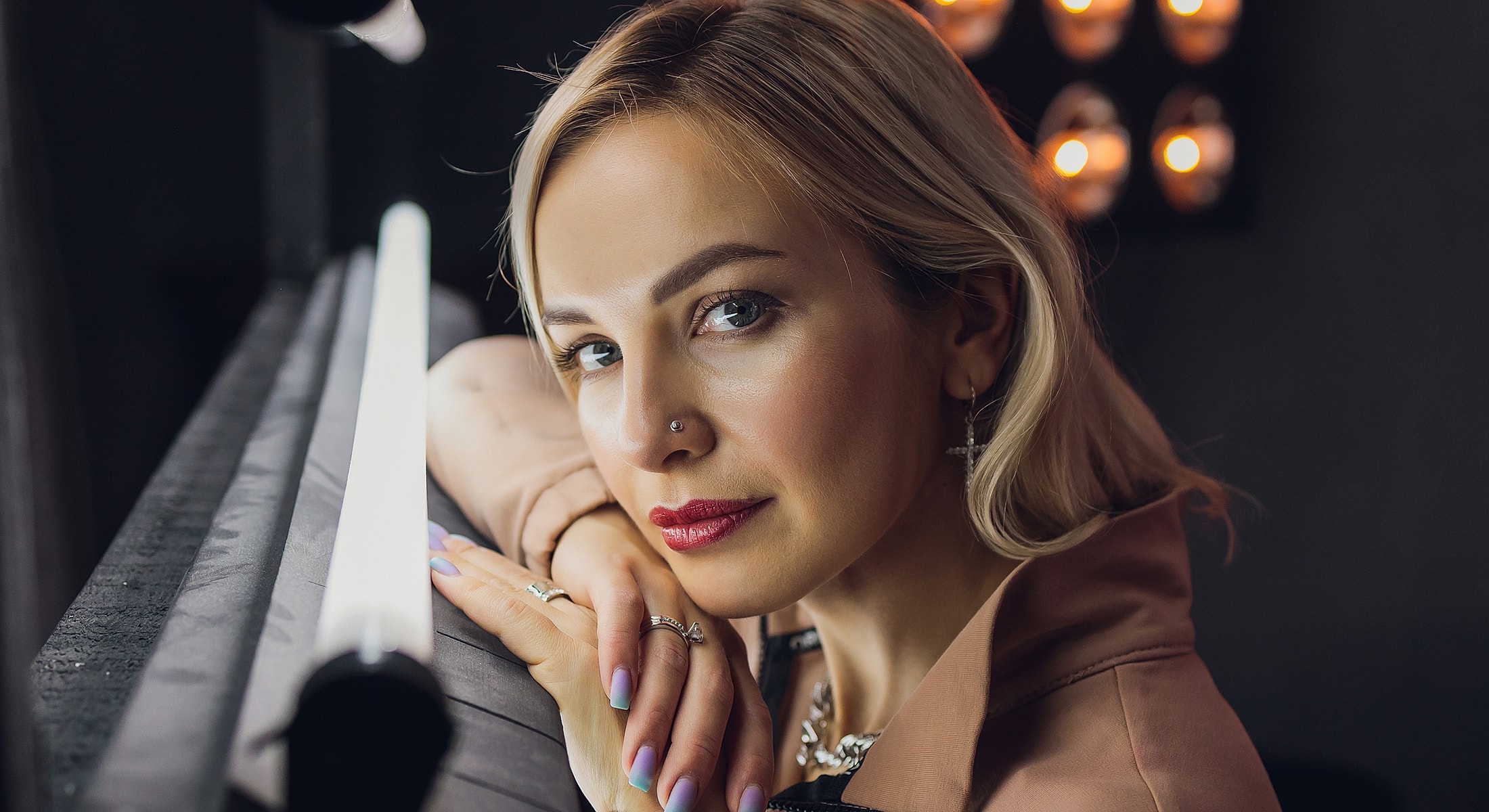 Portrait of a woman with styled hair and makeup.
