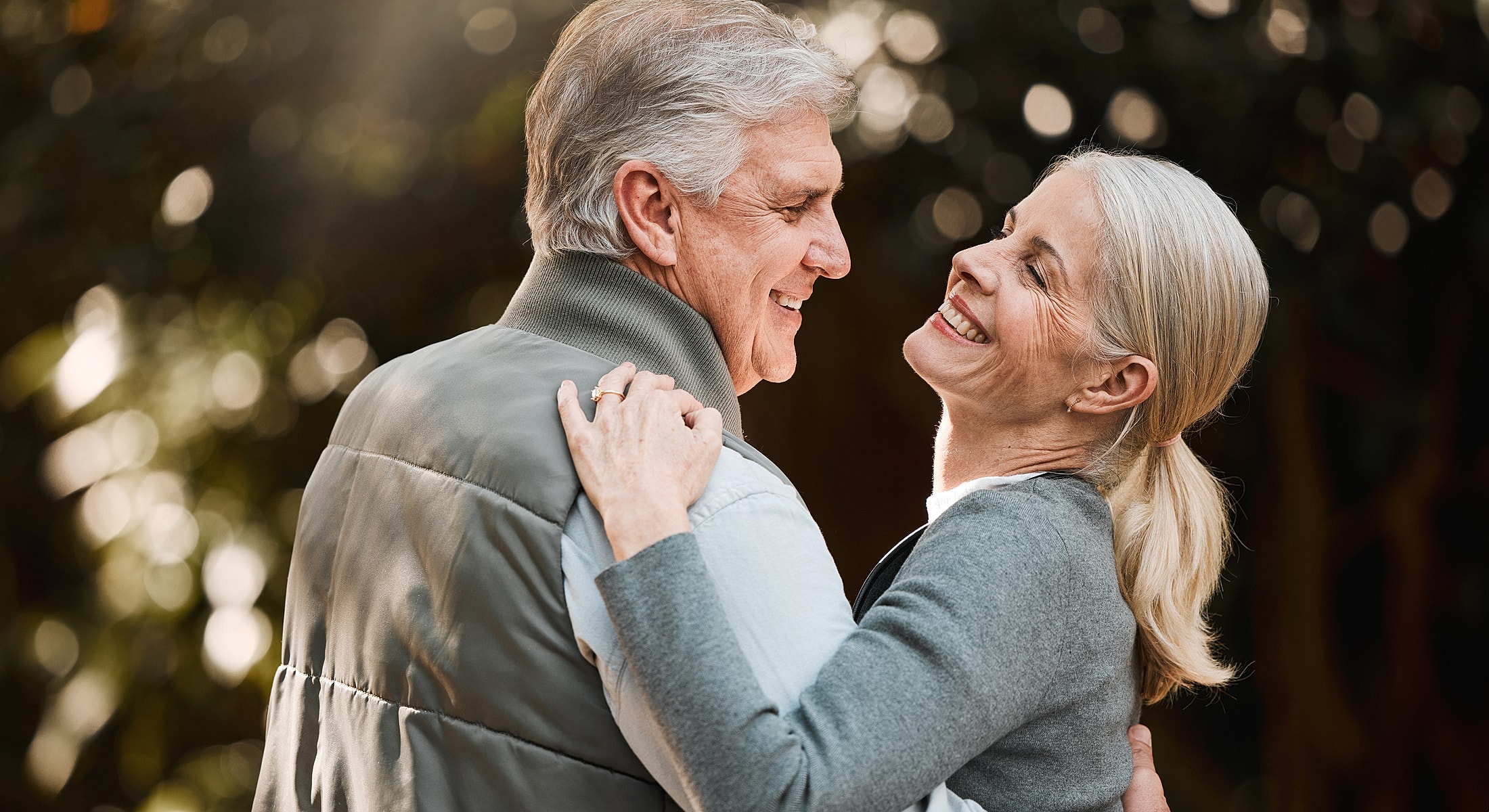 Elderly couple enjoying a joyous moment together.